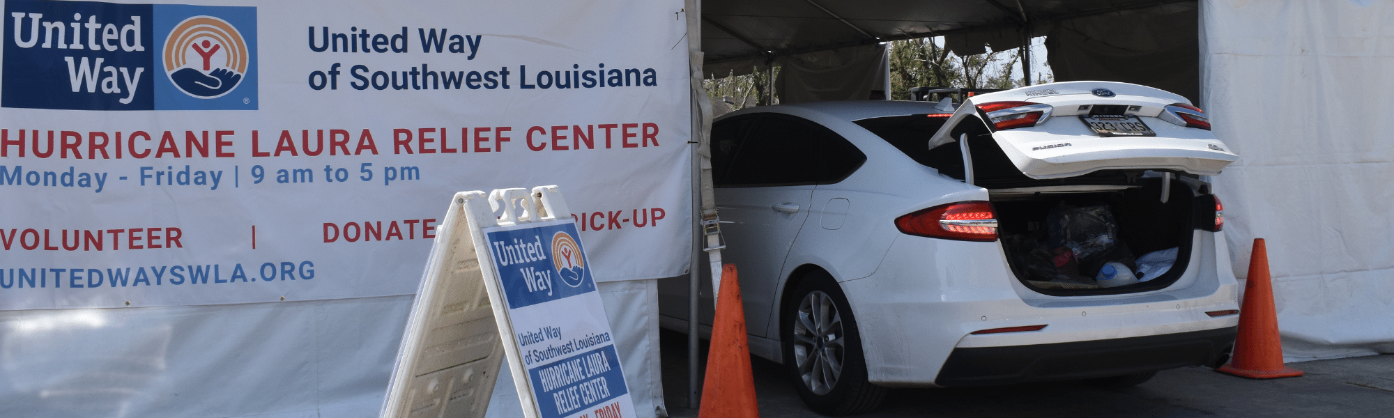 cars driving through relief center following hurricanes laura and delta